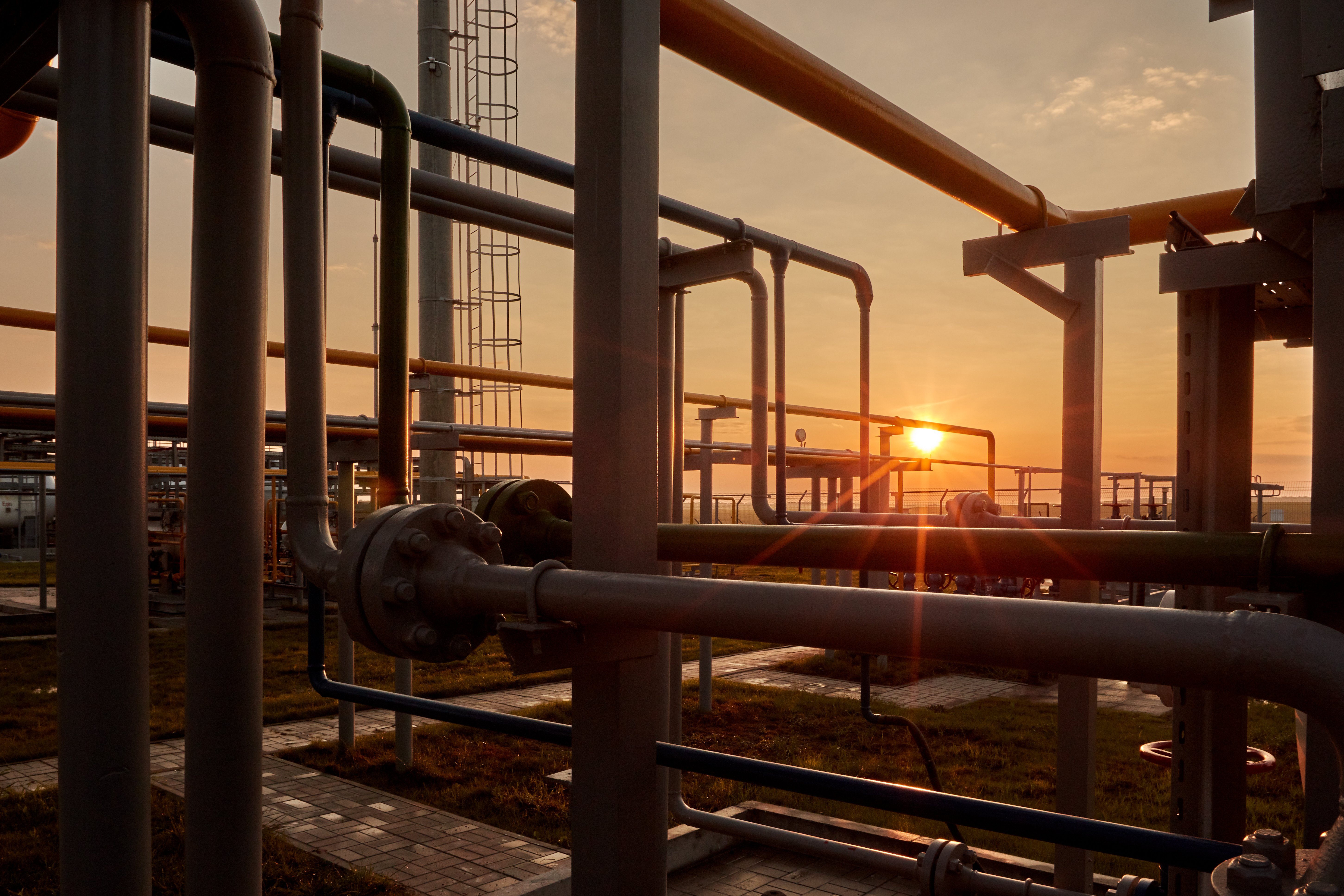 natural gas pipes connector at sunrise