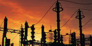 power lines against an orange sky