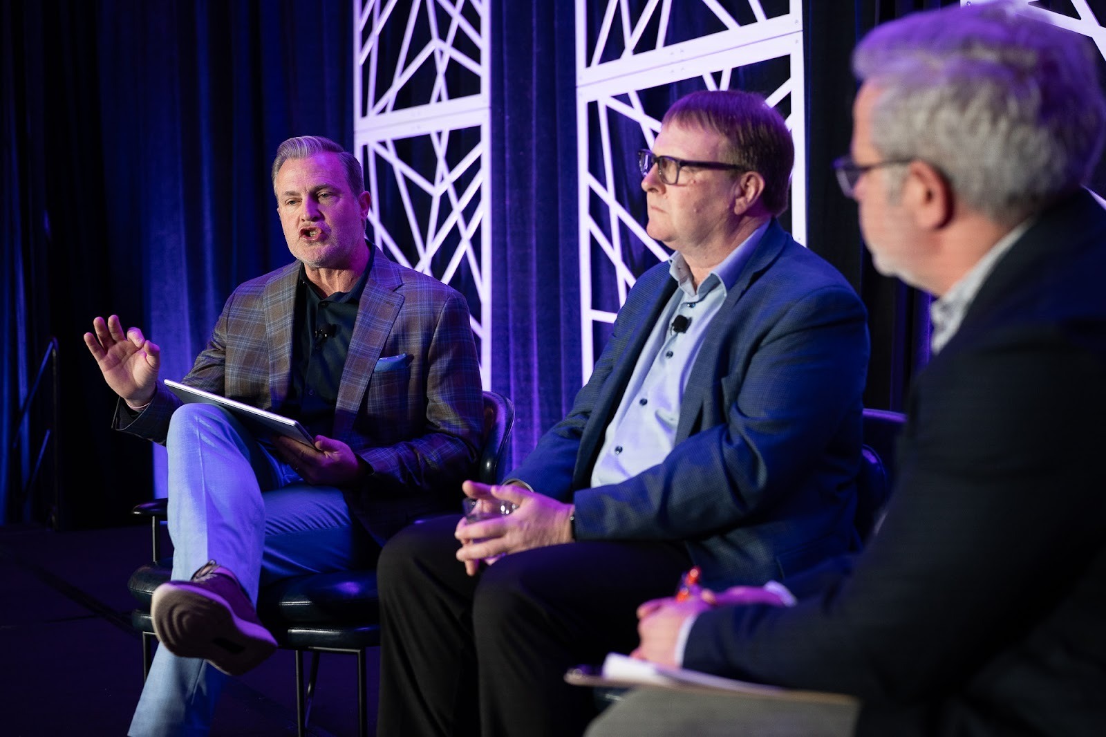 Lanny Nickell, left, and Elliot Mainzer, center, discussed expanding western markets.